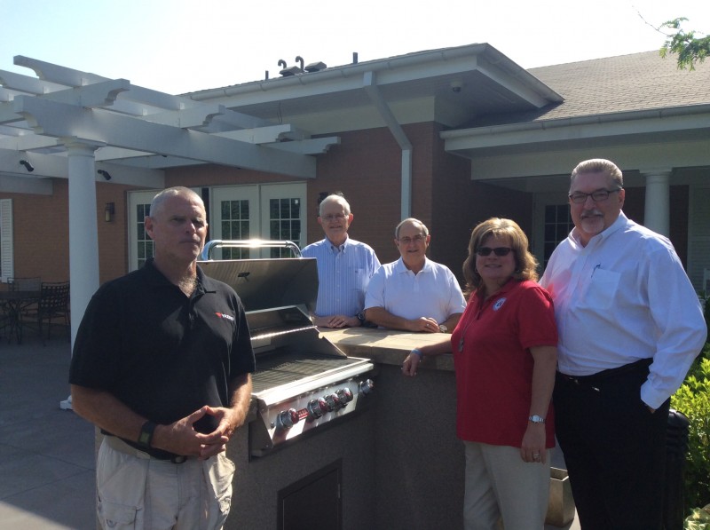 President of MOAA, Tom Hickerson, Jan and Jim Edens with new grill